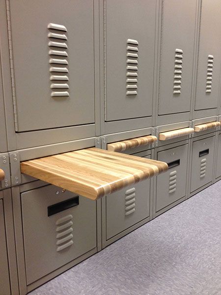 officer locker room with pull out bread board bench
