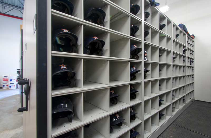 baseball helmet storage on mechanical assist high-density system