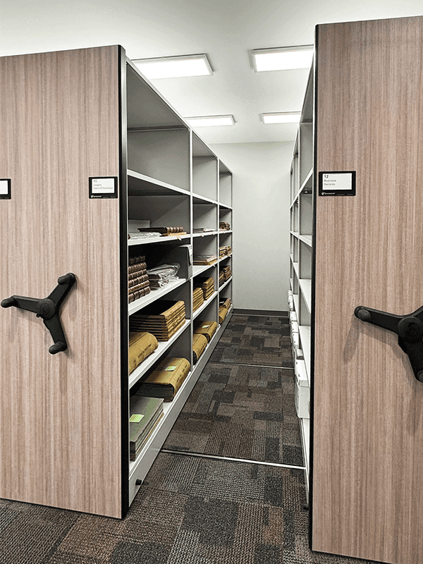 Spacesaver 4-Post FreeSpan Shelves on a mechanical-assist system holding Benzie Area Historical Society's collections