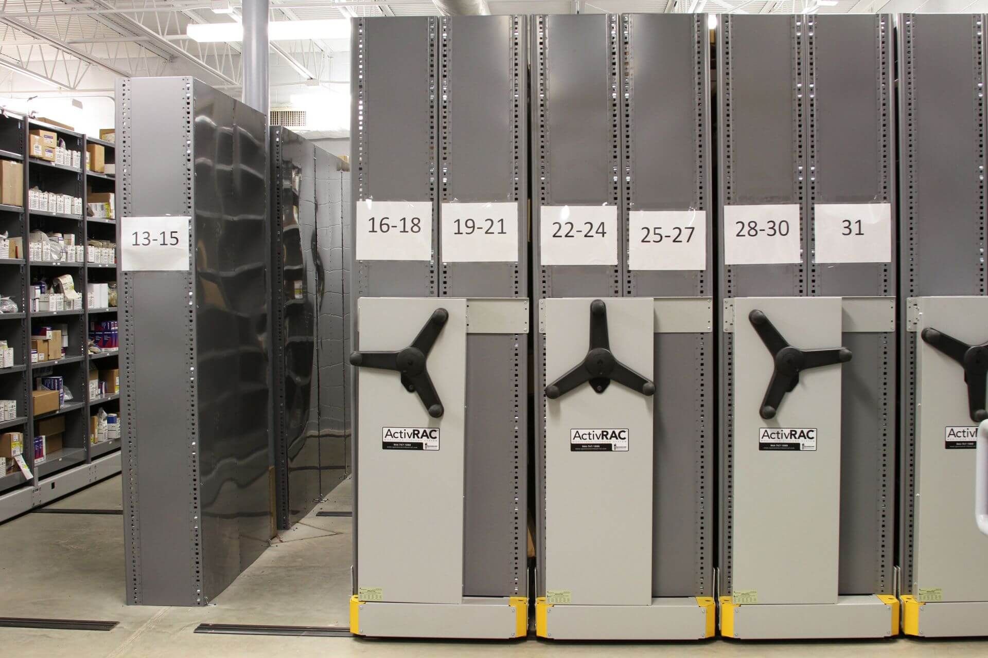 Spacesaver mechanical-assist high-density mobile system holding auto parts