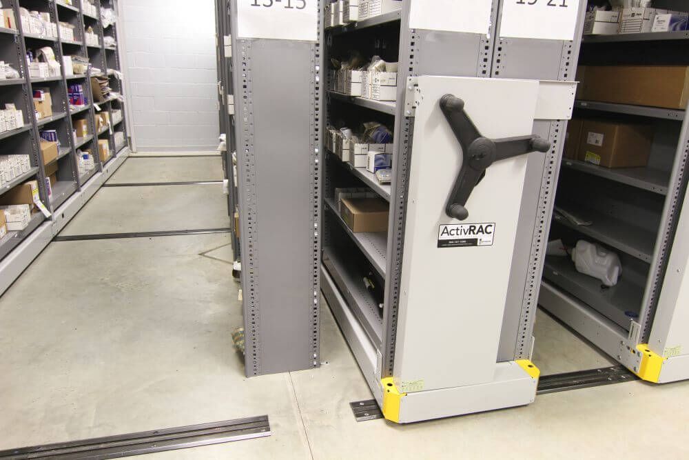 Spacesaver Mechanical-Assist High-Density System holding auto parts focusing on the system's rails