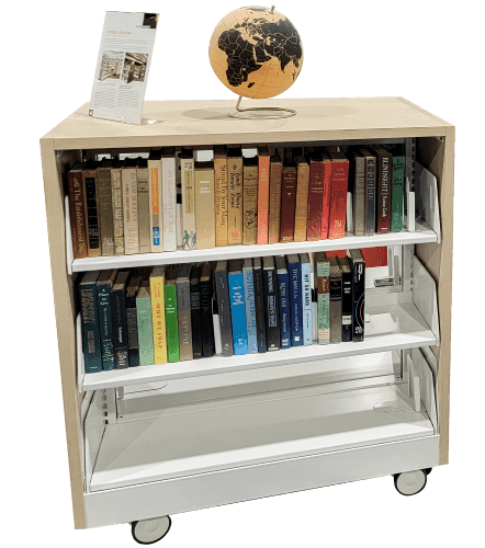 Spacesaver Flexible Shelving system holding books and a globe