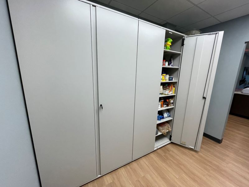 Spacesaver cabinets installed in Fort Fire Department's kitchen holding different food and supplies