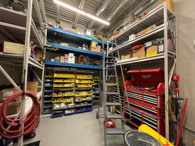 Spacesaver Xtend Shelving holding various maintenance tools and materials in Fort Fire Department's warehouse storage area