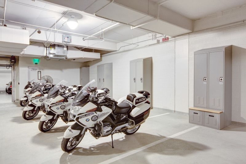 motorcycles in police department garage and patrol lockers against the back wall