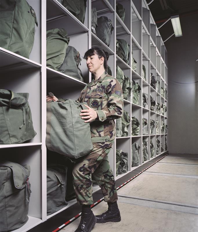 Soldier stashing gear bag in spacesaver storage solution