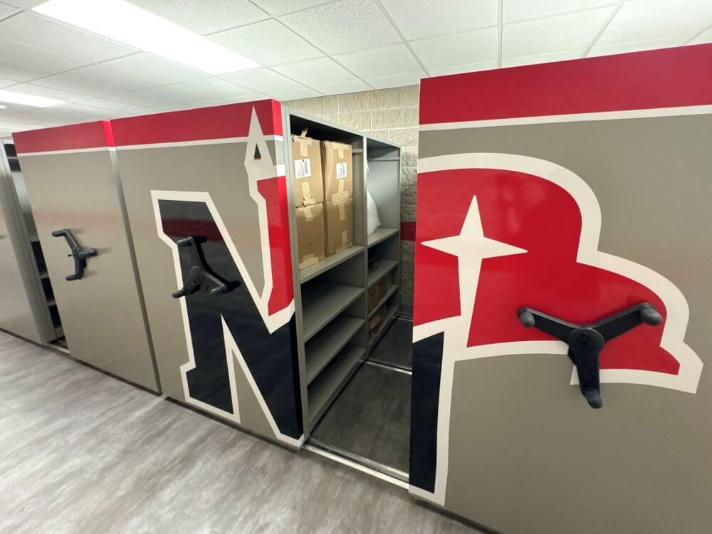 Mechanical Assist system with custom Northwestern Raider's graphics on the end panels