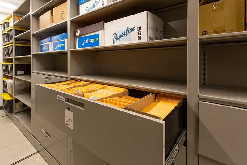 filing cabinet on shelving system in police department