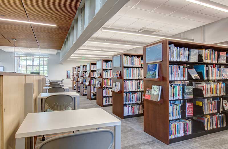 cantilever library shelving with books and study desks