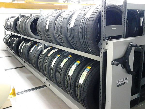Wheels and tires stored on ActivRAC mobile storage system on the second floor of a room