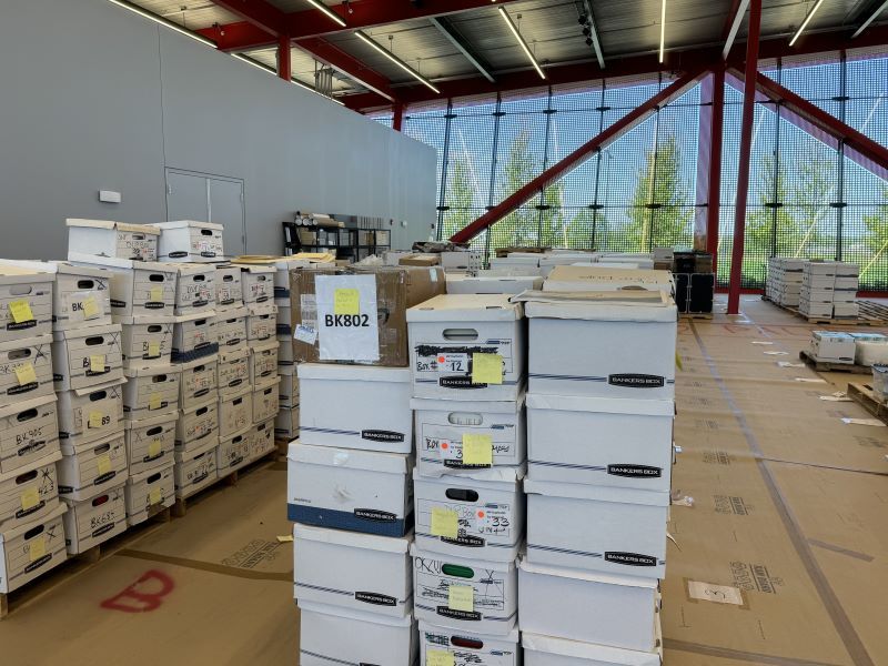 Stacks of boxes of Pritzker's artifacts inside the new Pritzker Military Archives Center