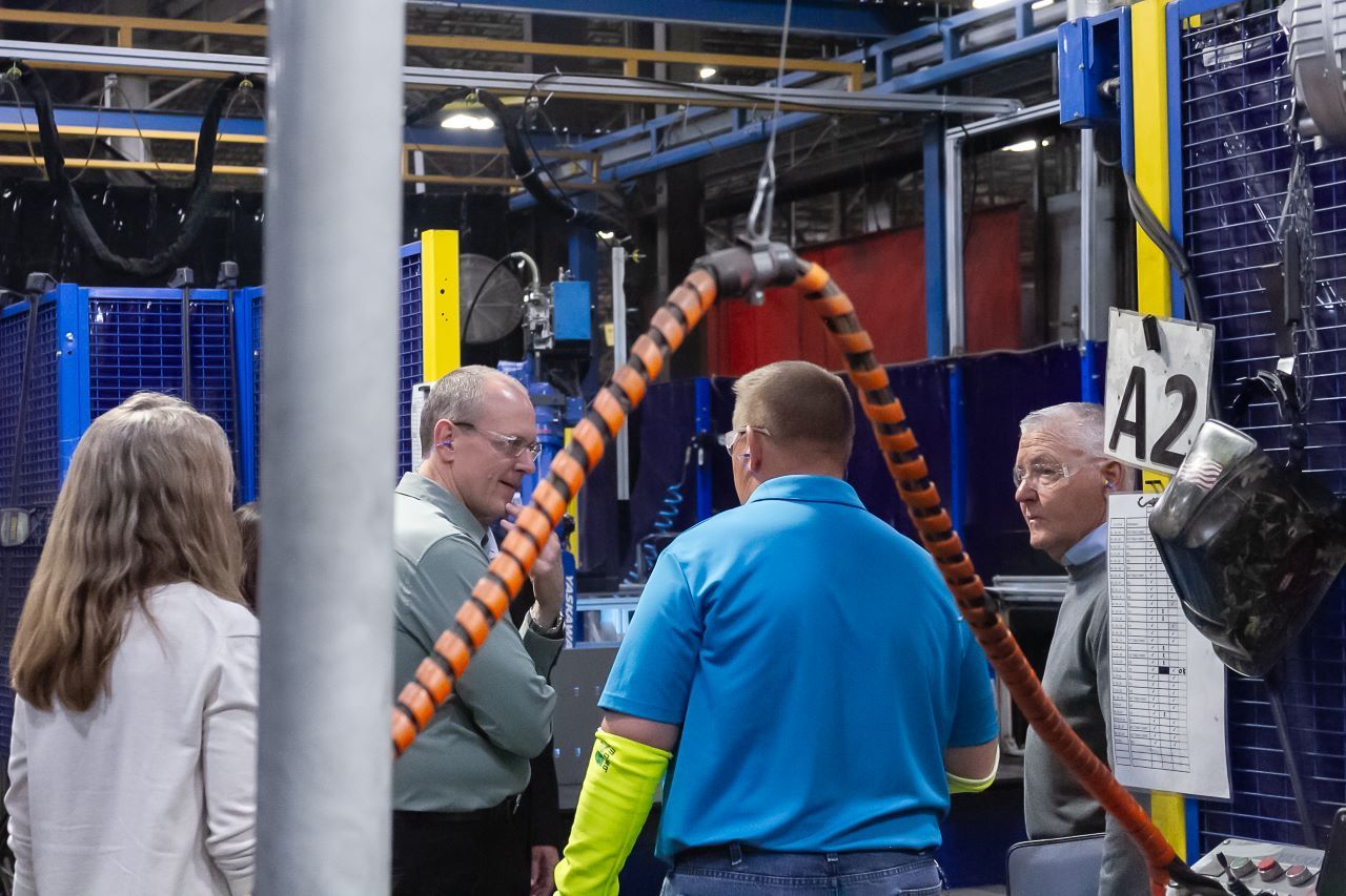 Spacesaver and KI leadership teams taking a tour of the Spacesaver plant