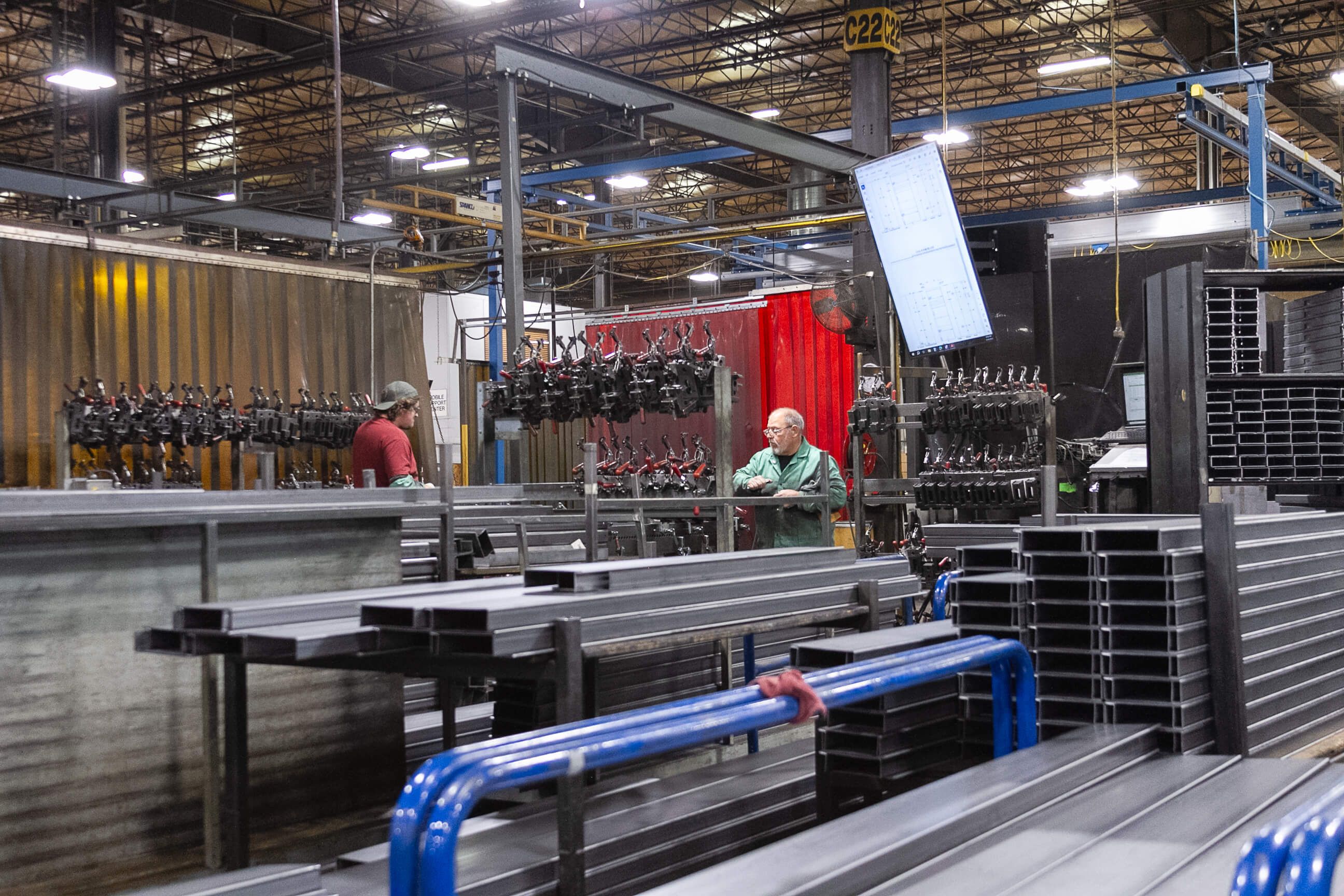 Spacesaver plant workers working on a fabrication line