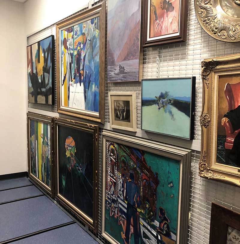 wall mounted art rack with art 