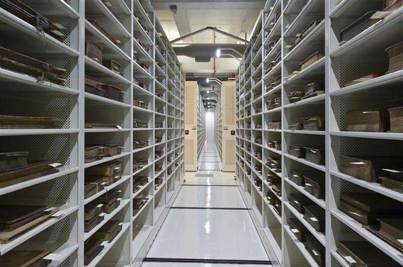 mobile archival storage system aisle containing rare books 