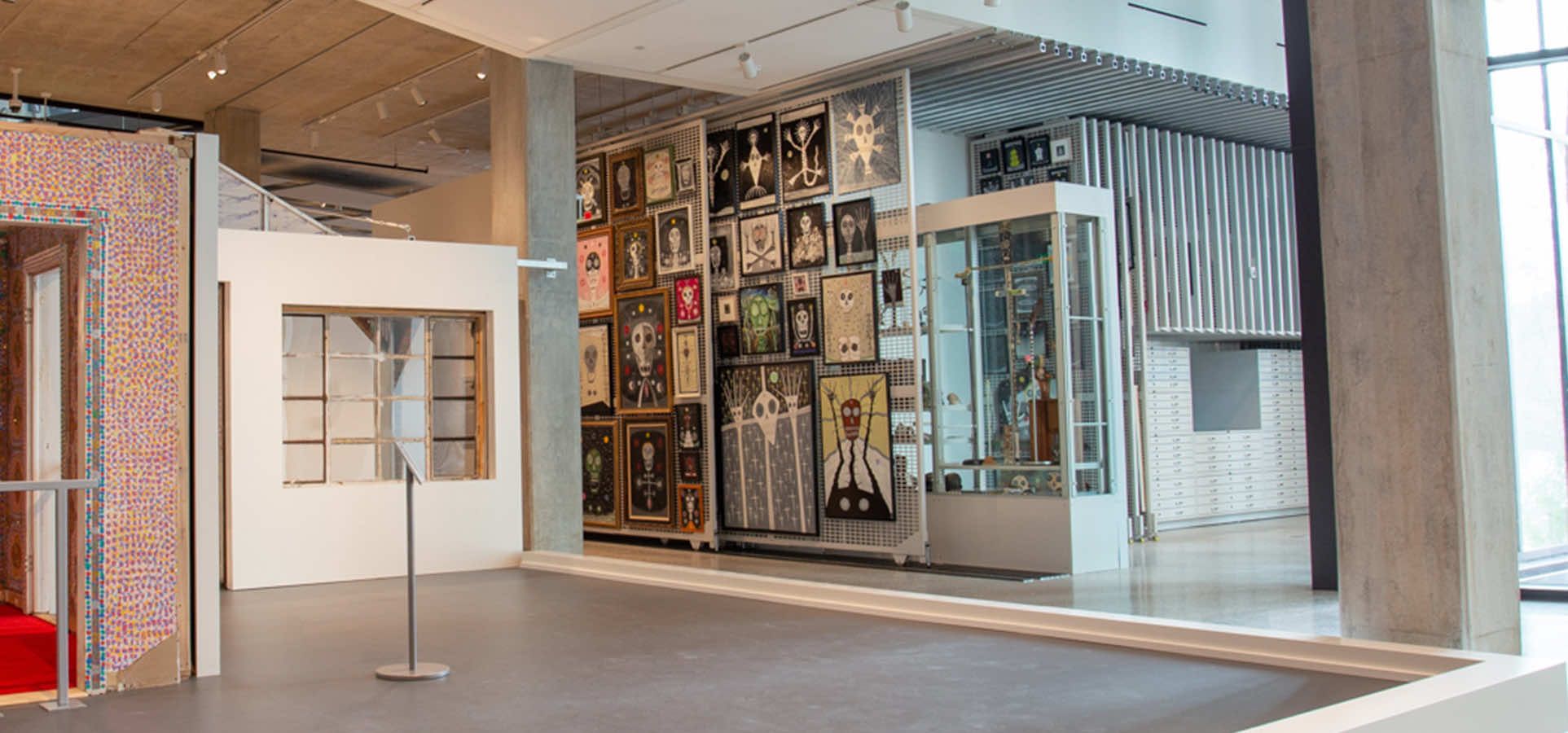 art museum collection displayed on hanging art racks