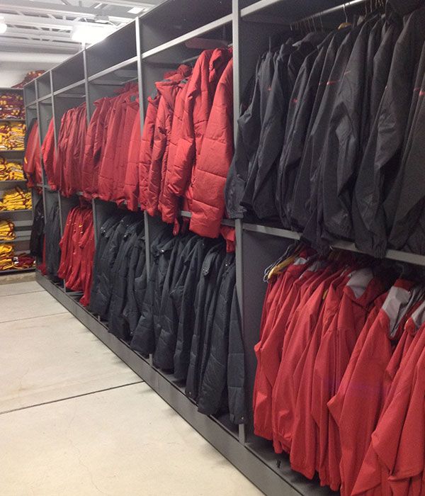 athletic hanging rail compact storage system holding jackets