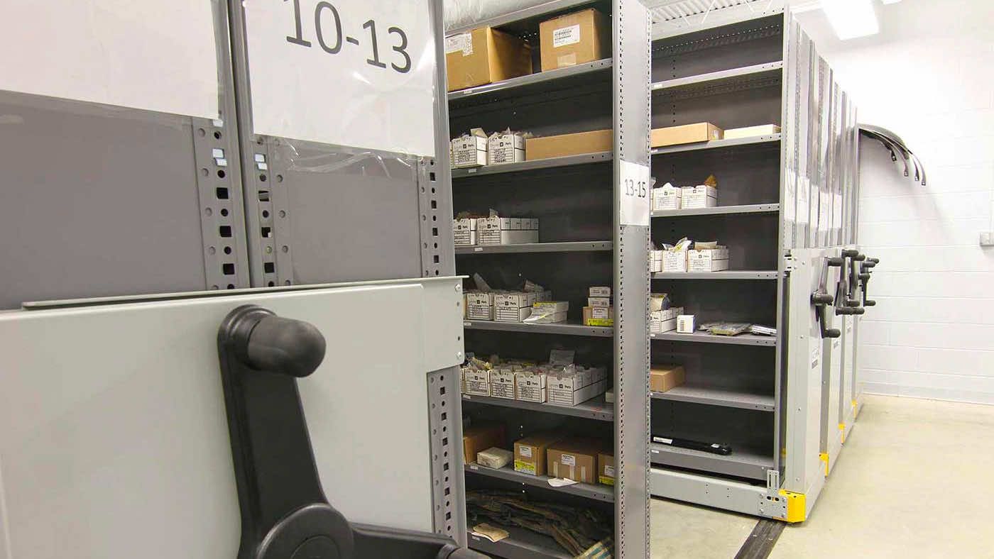 auto parts stored on mechanical assist shelving system