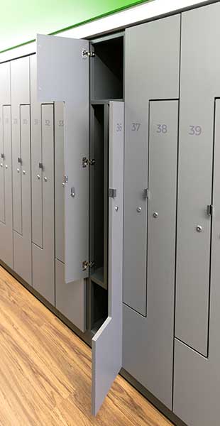 Open personal storage locker in a wall of lockers