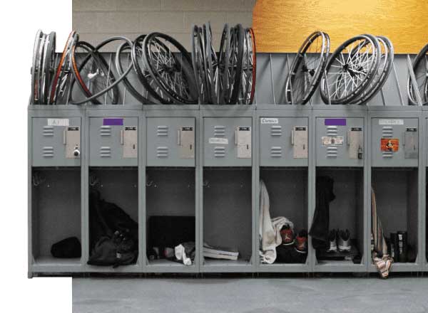 Various gear and wheels stored on custom lockers for UWW's wheelchair basketball team