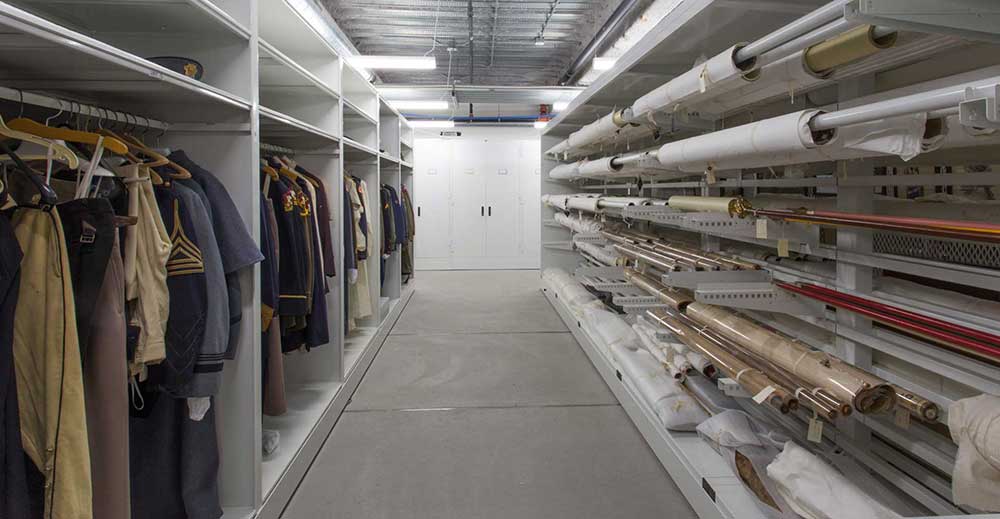 Clothes storage in high-density mobile storage system and rolled textiles stored on rolled textile racks