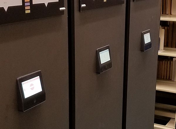 touch screens on three stacks of a powered mobile shelving