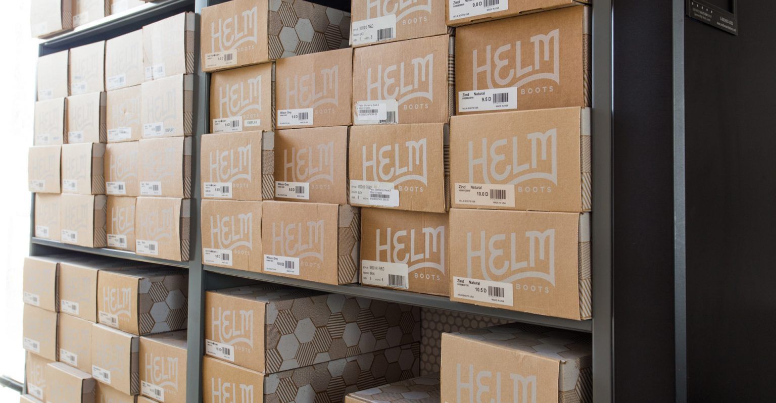 Boxes of helm boots on a high-density mobile storage system