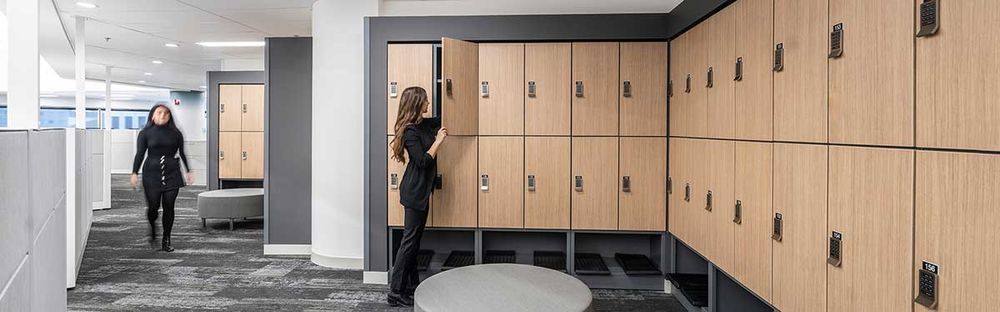 employees in a modern looking office opening day use lockers