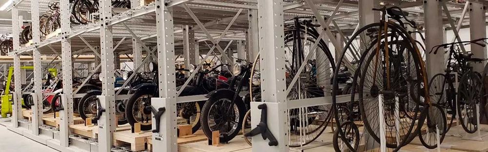 vintage bicycle collection on mechanical assist storage system