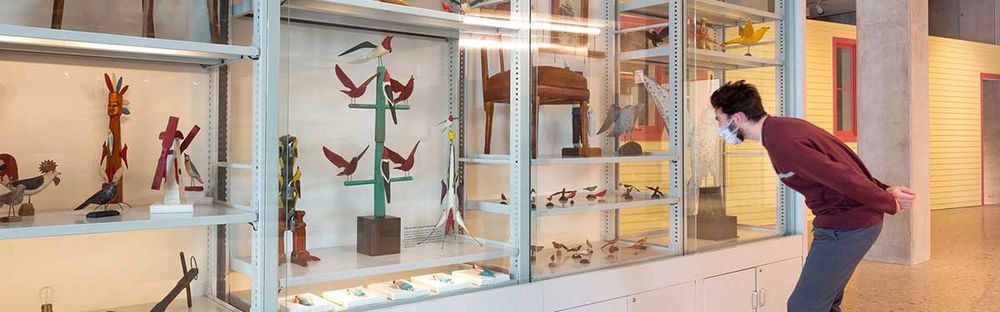 man looking into museum display provided by Spacesaver