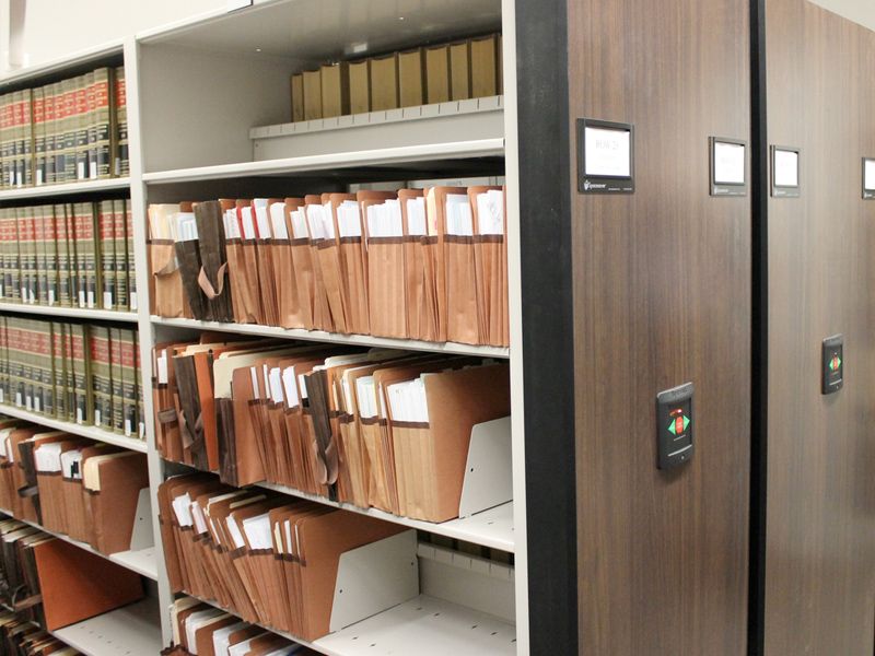 law library powered mobile system holding expanding folders and books