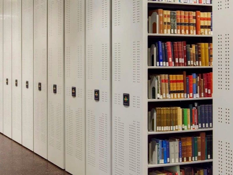 powered mobile shelving with books in a law library