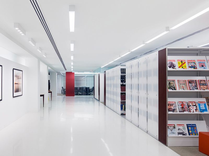 law office with mobile shelving system storing books and magazines
