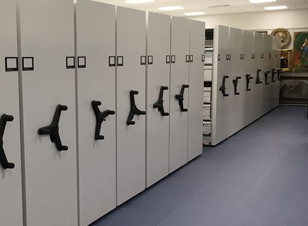 mechanical assist storage system for library archives