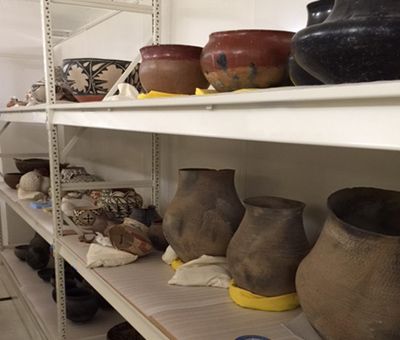 local native pottery on spacesaver shelving
