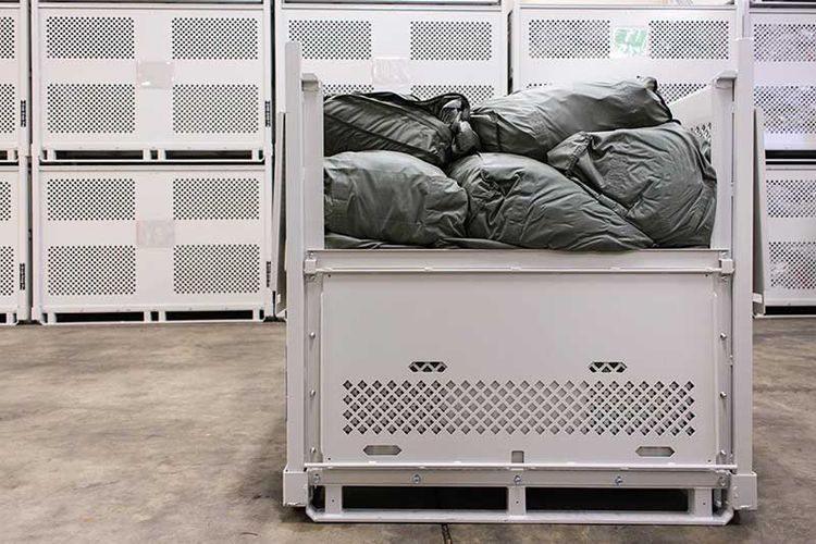 parachutes stacked in parachute storage container