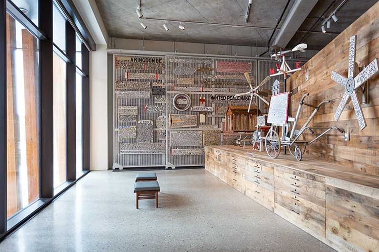 floor supported pullout art racks with artwork