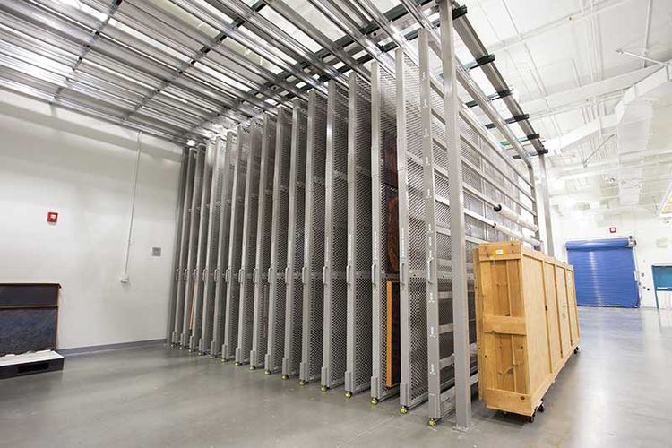 Holocaust museum overhead supported art rack