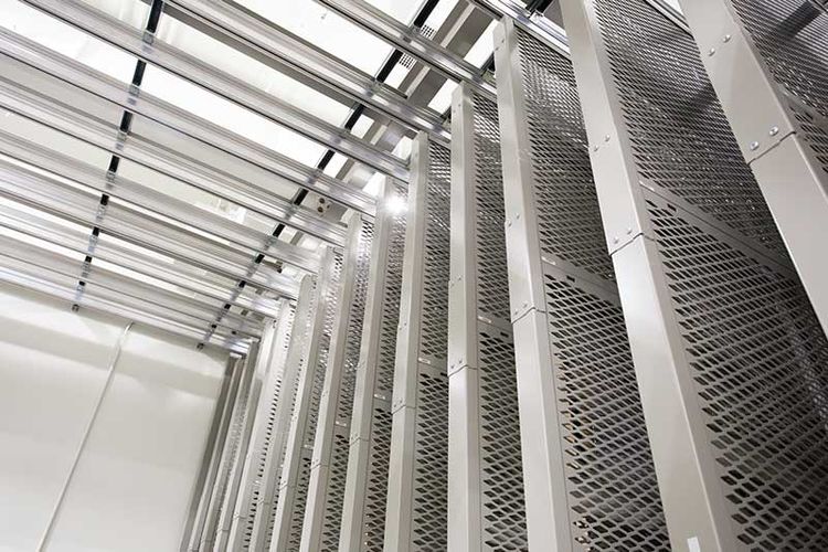 Holocaust museum overhead supported art rack