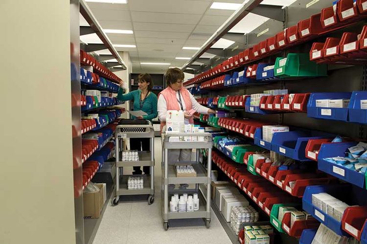 bin storage system on Spacesaver shelving