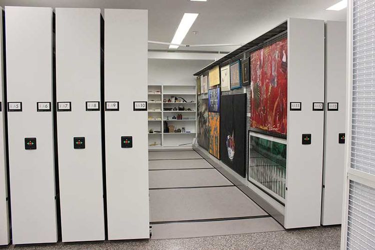 carriage mounted art rack on powered mobile compactor system