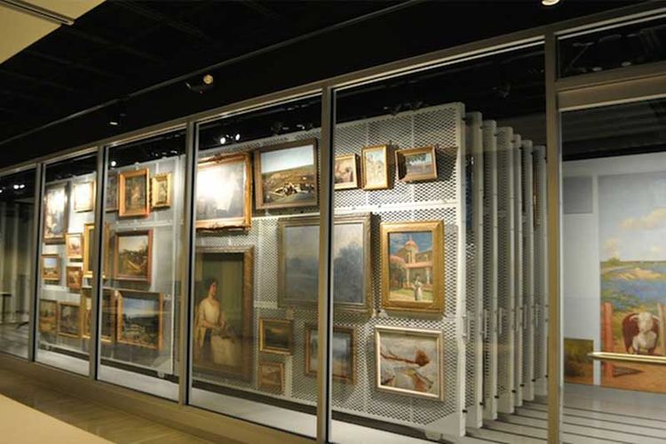 floor supported pullout art racks with artwork