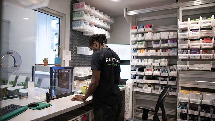 modular storage system with bins in dispensary 