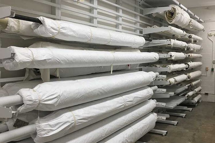 rolled textile racks on cantilever shelving