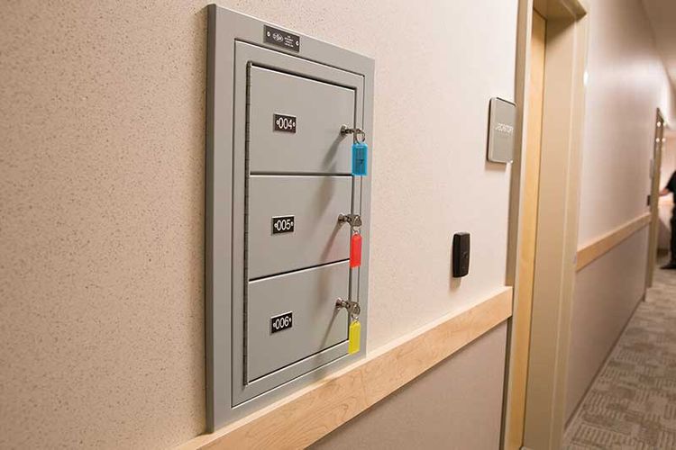three compartment wall-mounted gun locker with keys