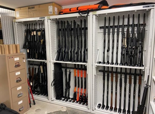 Various long guns stored in Spacesaver weapons lockers
