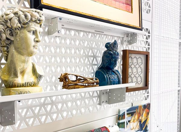Mod glider pro art rack hanging accessory with frames and multiple busts on shelf