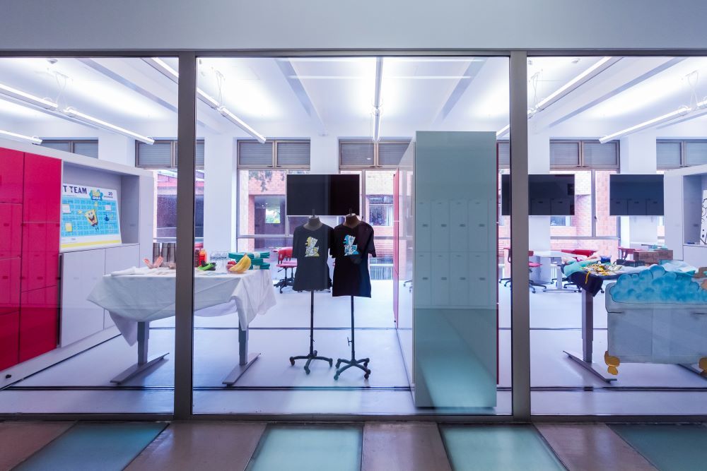 university room with movable wall partitions and tables between them