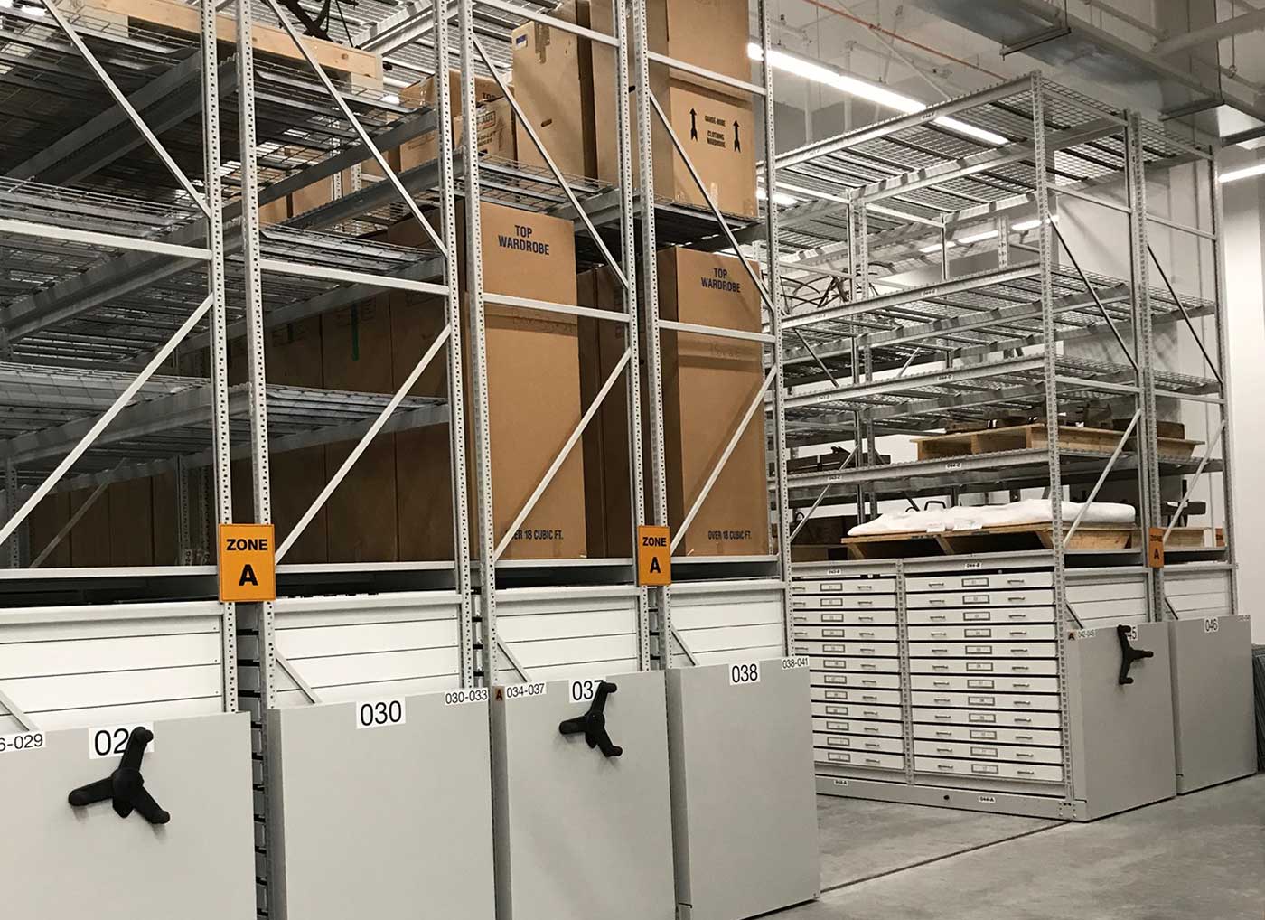 mechanical assist mobile racking system holding boxes