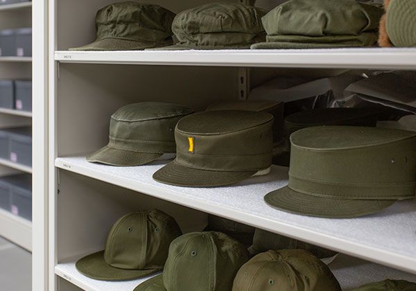 Museum's collection of historic military hats stored on high density mobile shelving
